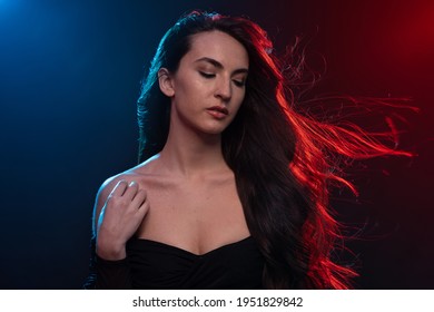 Sensual Brunette Woman Close Up Portrait Wearing Black Body. Colorful Gel Photography.