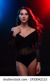 Sensual Brunette Woman Portrait Wearing Black Body. Colorful Gel Photography.