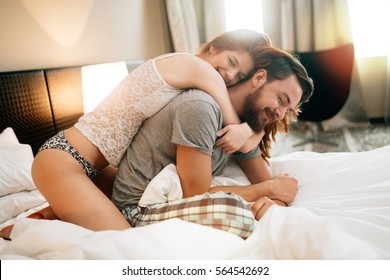 Sensual Couple In Bed Cuddling