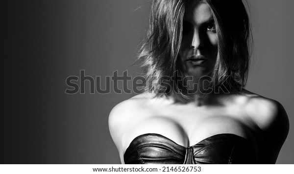 Sensual\
female breast. Silicone implants. Sexy woman in erotic fetish wear.\
Sexy fetish-wear. Sensual girl, boobs, bdsm. Woman with large\
breasts. Erotic topless, boob. Black and\
white.