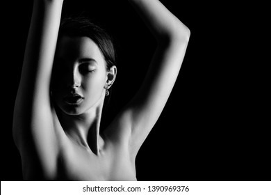 sensual girl on black background with copy space, monochrome