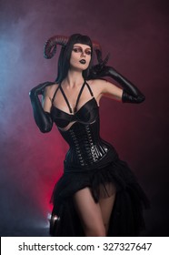 Sensual gothic girl with horns, Halloween theme 