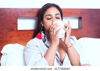 Sensual Mexican Woman Drinking Coffee In Bed