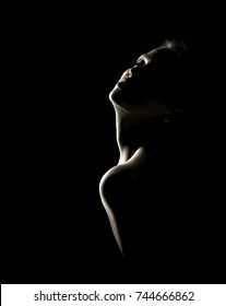 Sensual Portrait Of Woman In Shadow On Dark Background