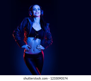 Sensual techno dancer woman in colorful club lighting. - Shutterstock ID 1233090574