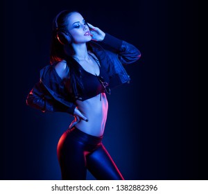 Sensual techno dancer woman in colorful club lighting. - Shutterstock ID 1382882396