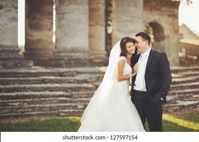 Sensual wedding Couple, groom and bride, holds each other and laughing
