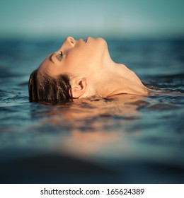 Sensual Woman Emerging From The Water.