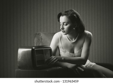 Sensual Woman Wearing Lingerie Listening Music On Old Radio