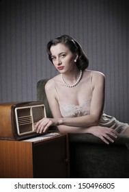 Sensual Woman Wearing Lingerie Listening Music On Old Radio