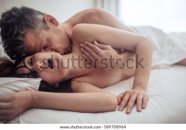 sensual young couple making love bedroom stock photo (edit now