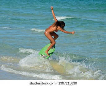 Sensuous Skimboard Surfer