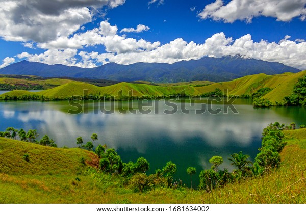 Sentani Lake is the largest lake in Papua\
Province, the lake which is divided by these hills looks very\
beautiful and is now the best place for community tourism objects\
in Jayapura district