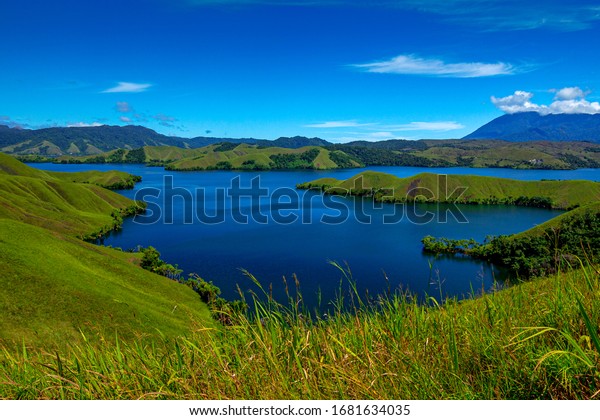 Sentani Lake is the largest lake in Papua\
Province, the lake which is divided by these hills looks very\
beautiful and is now the best place for community tourism objects\
in Jayapura district