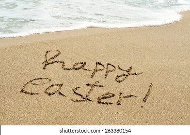 The Sentence Happy Easter Written In The Wet Sand Of The Seashore Of A Beach With A Foamy Wave In The Background