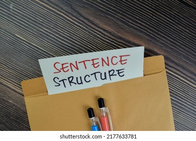 Sentence Structure Text On Document Above Brown Envelope.