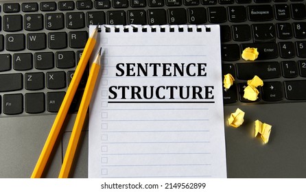 SENTENCE STRUCTURE - Words In A White Notepad On The Background Of A Laptop With Pencils. Business Concept