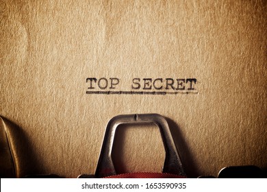 The sentence, Top Secret, written with a typewriter.