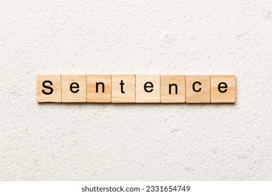 Sentence word written on wood block. Sentence text on table, concept.