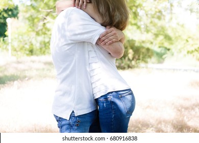 Sentimental Happy Couple In Love Bonding.Young Couple Having Fun And Dancing In The Park On A Sunny Day

