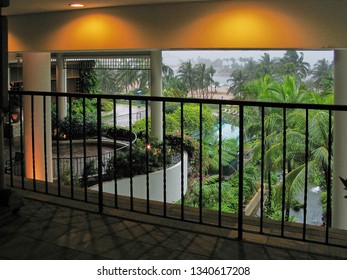 SENTOSA, SINGAPORE. 28th Nov 2004. From The Reception Area Of The Shangri-La Rasa Hotel Looking Out To The Afternoon Tropical Rainstorm Bending The Palms.