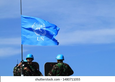 Sentul, West Java, Indonesia - May 18th, 2011: Indonesia's UN Peacekeeper with UN flag on the left side