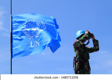 Sentul, West Java, Indonesia - May 18th, 2011: Indonesia's UN Peacekeeper with UN flag on the left side