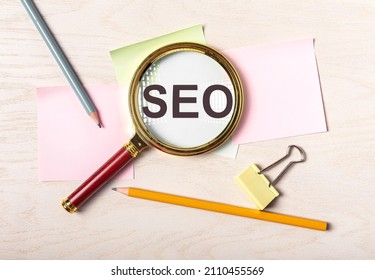 SEO acronym. Search engine optimization concept and magnifier