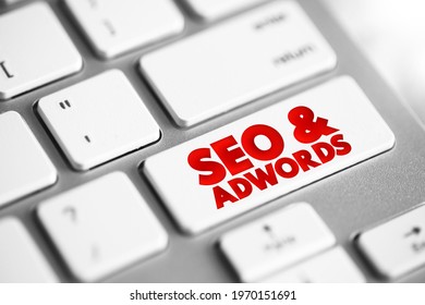 Seo and Adwords text button on keyboard, business concept background