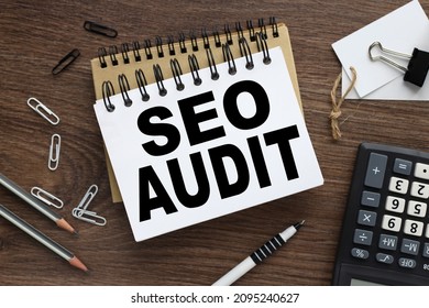 SEO audit. two notebooks with a spring on a wooden background with a pencil calculator pen business concept. Office concept. View from above. - Shutterstock ID 2095240627