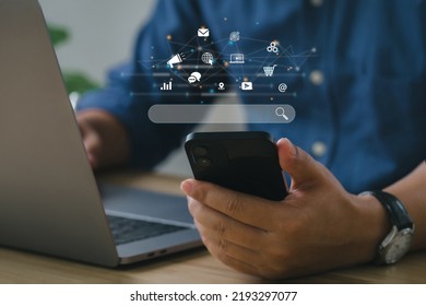 SEO Concept. Businessmen use smartphones with laptops. SEO icon for analysis SEO Search Engine optimizing your website to rank in search engines or SEO. best promoting ranking traffic on your website.