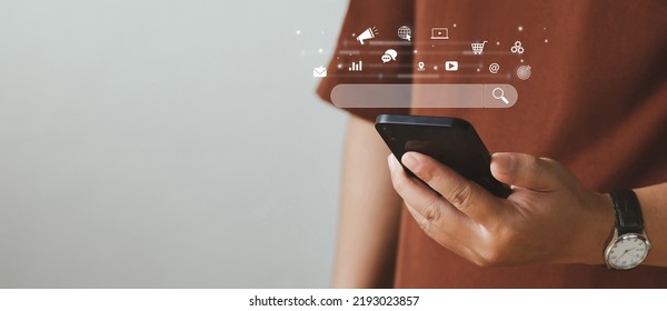 SEO Concept. Men use smartphones with laptops. SEO icon for analysis SEO Search Engine optimization your website to rank in search engines or SEO. best promoting ranking traffic on your website. - Shutterstock ID 2193023857