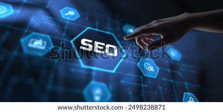 SEO Search engine optimisation digital internet marketing concept. Hand pressing button on screen.