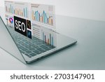 SEO (Search Engine Optimization) concept. Laptop with virtual dashboard for marketing data analysis, reports, and charts. Business analytics with copy space.