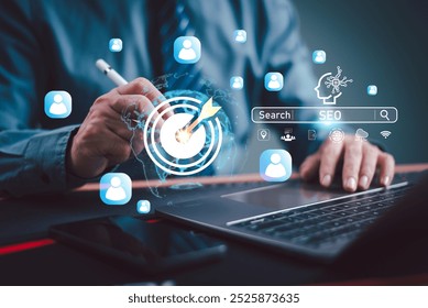 SEO Search Engine Optimization concept. Businessman use AI target icon, SEO website to rank search engines or SEO. Search with Ai assistant on computer screen. Artificial Intelligence data technology