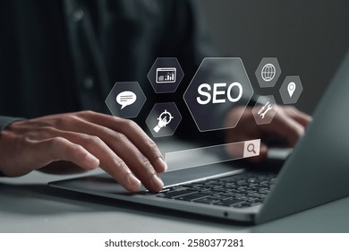 SEO search engine optimization concept, Marketing ranking traffic website, internet technology for business company. Businessman use laptop with SEO icons on virtual screen. 