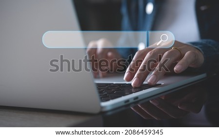 SEO, search engine optimization, internet browsing concept. Business woman working on laptop computer, searching information at office, online content, data search concept