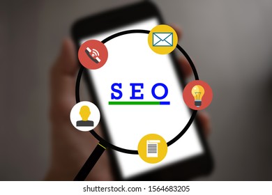 SEO - Search Engine Optimization for Online Marketing Concept. Modern graphic interface showing symbol of keyword research website promotion by optimize customer searching and analyze market strategy.
