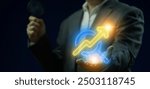 SEO, Search Engine Optimization for promoting ranking traffic on website and optimizing your website to rank in search engines. Businessman shows glowing neon line of SEO icon on virtual screen.