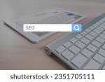 SEO, Search Engine Optimization ranking concept, magnifying glass, the idea of promote traffic to website