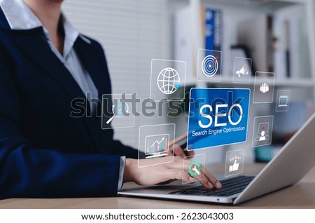 SEO Search Engine Optimization Strategy Concept. Businesswoman working on laptop with SEO icons and marketing analytics, representing search engine optimization. digital marketing, reach, backlink,