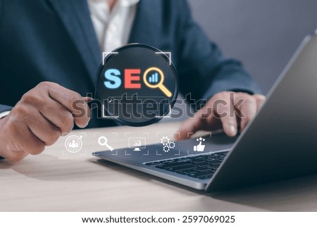 SEO search engine optimization technology concept and web search on internet, man hold magnifying glass show process trying to increase quality traffic or digital marketing search ranking strategy.