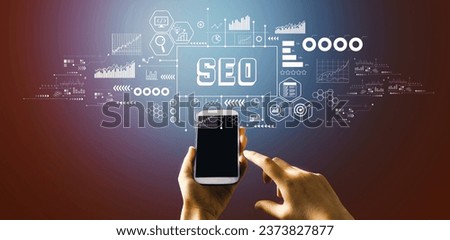 SEO - Search Engine Optimization theme with hand pressing a button on a technology screen