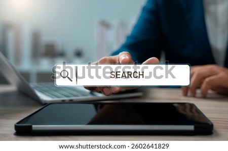 SEO search engine optimization, SEO tools,  Businessman using laptop and tablet to gain insights into search engine technology, Browsing the internet, and connecting to the digital world.
