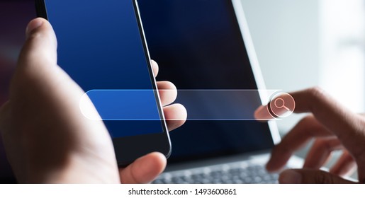 SEO, Search Engine Optimization, Web browser concept. Business man internet networking, browsing  data on blue screen mobile smart phone and laptop computer in office, multimedia, modern style