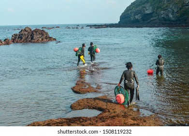 Seogwipo, South Korea - November 6th, 2018: Jeju 'haenyeo' (women Divers) Set Out To Dive Near Songsan Ilchulbong.