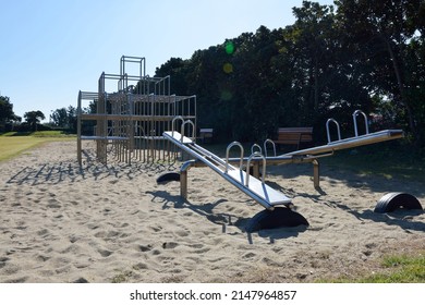 Seogwipo-si, Jeju-do, South Korea - October 31, 2021: Morning View Of Sand Playground With Rides, Seesaw And Jungle Gym At Seongsan Elementary School
