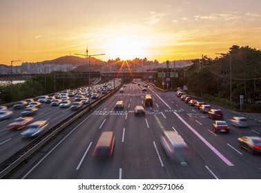 Seongdong-gu, Seoul, South Korea - May 18, 2021: Sunset View Of Cars Moving On Gangbyeon Expressway Against N Seoul Tower On Namsan Mountain
