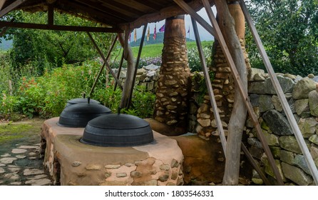 Seosan, South Korea; August 14, 2020: For Editorial Use Only.Old Fashioned Cooking Cauldrons Set In Primitive Earth Oven At Haemieupseong Fortress.