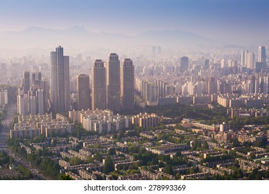 Seoul City And Downtown Skyline In Sunset In Misty Day, South Korea.